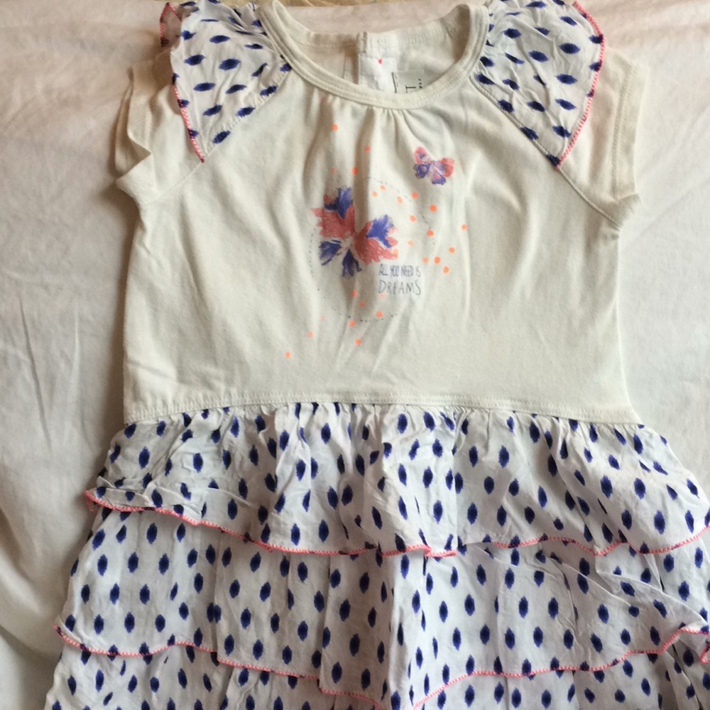 Ruffles dress with matching cropped leggings.
